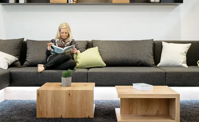 Woman on sofa in smart home living room